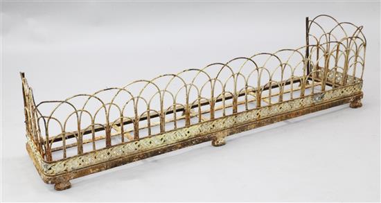 A Victorian painted wrought iron fire curb, 4ft 6in.